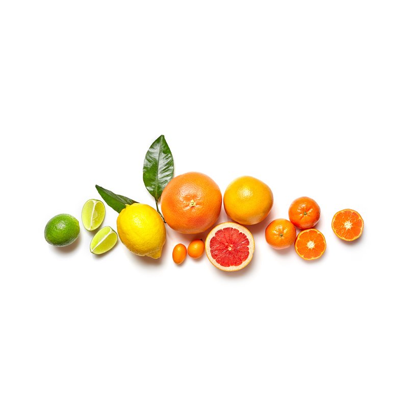 Life Extension Europe, line of fresh citrus fruits, ranging from green to orange  from left to right, in center of image on white background